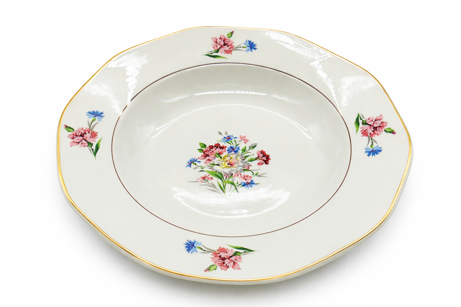 Assiette creuse ancienne en faïence fine, décor floral peint au centre, motifs floraux répartis et liseré doré sur le bord